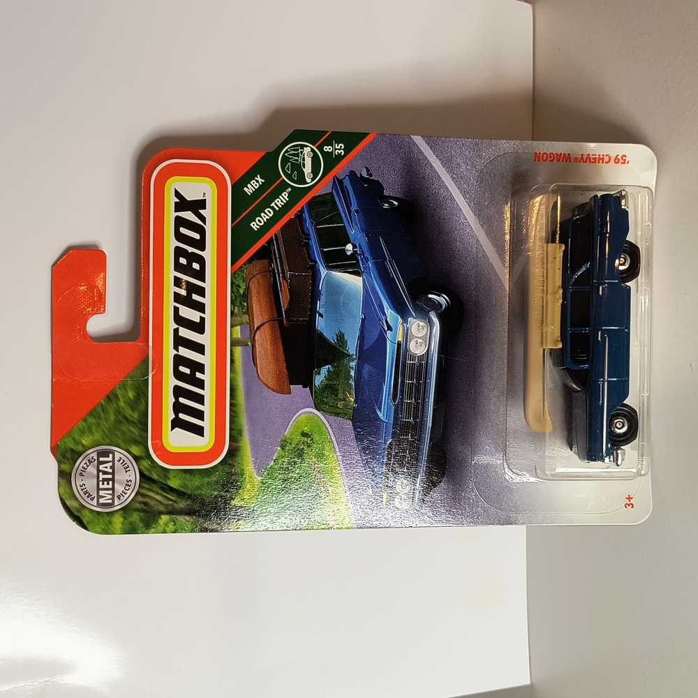 D8  Matchbox 59 chevy wagon with canoe   shipping protector